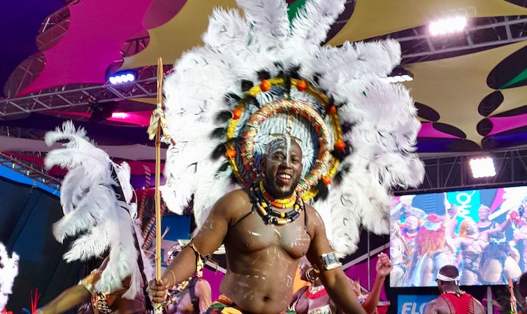 Kente Africa masquerader with Insane Mas Band at Antigua Carnival 2019.